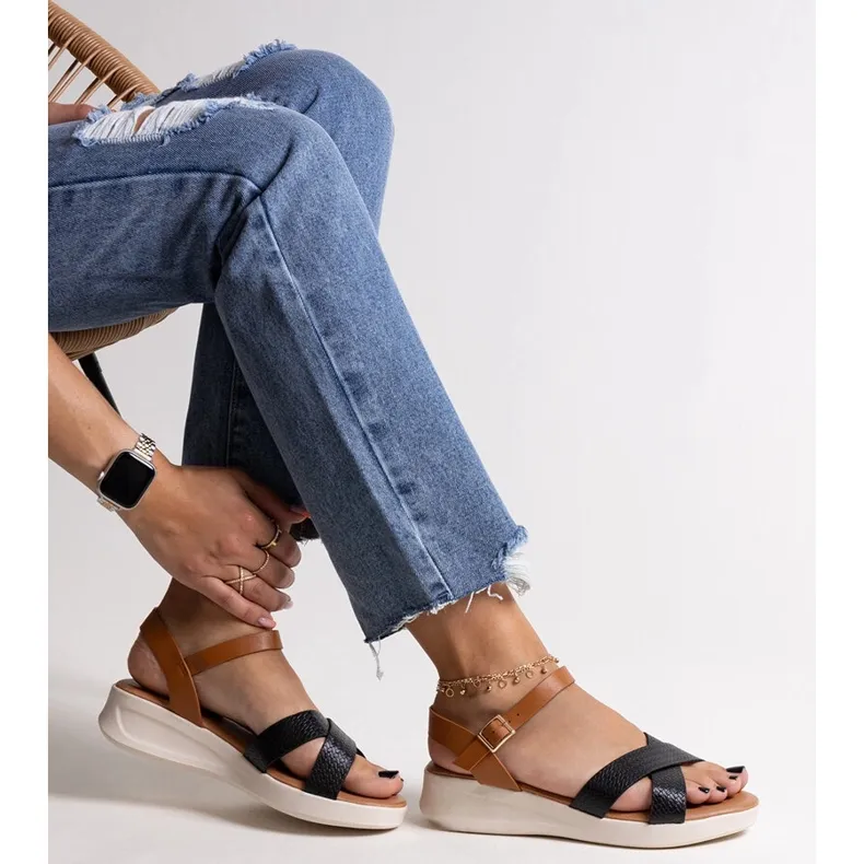 Black and brown low wedge sandals by Hakima