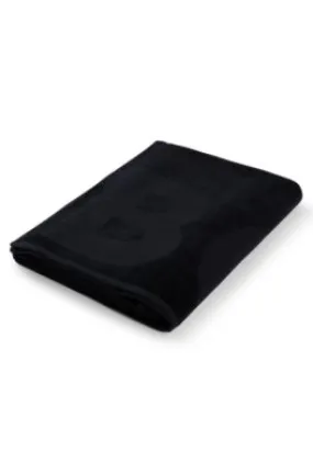 Cotton bath sheet with logo and signature-stripe strap