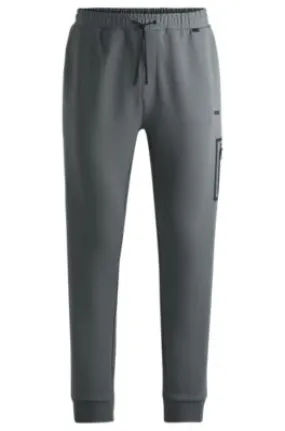 Cotton-blend tracksuit bottoms with decorative reflective logo