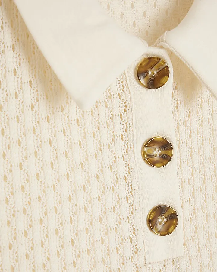 Cream sleeveless crochet polo top