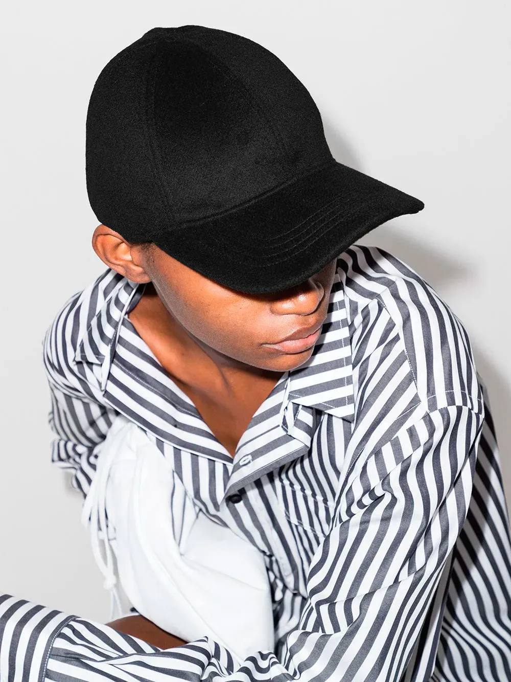 Curved-peak baseball cap