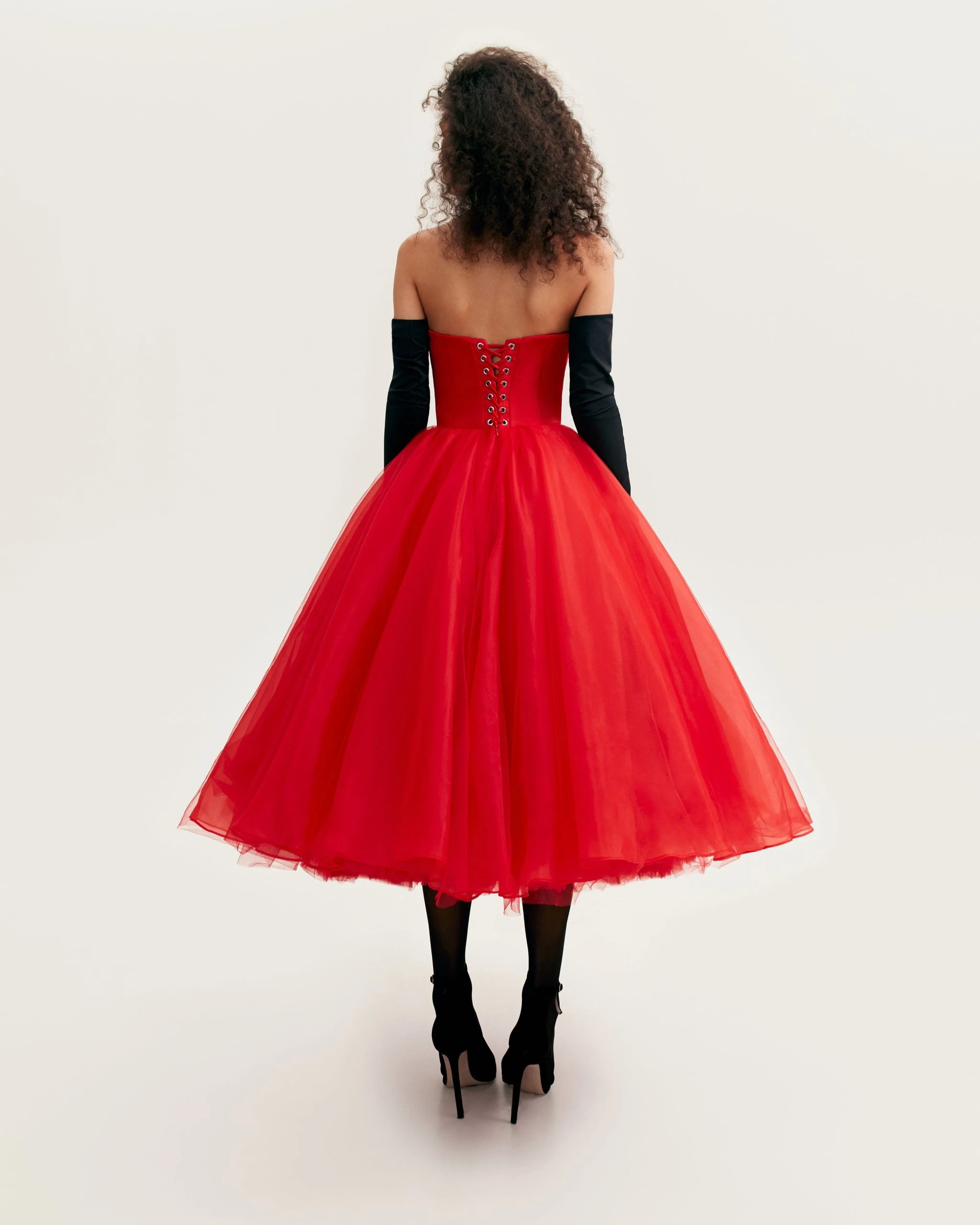 --Dramatic red organza dress adorned with Milla’s signature and black gloves, Xo Xo-