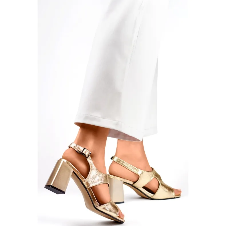 Elegant women's golden high-heeled sandals