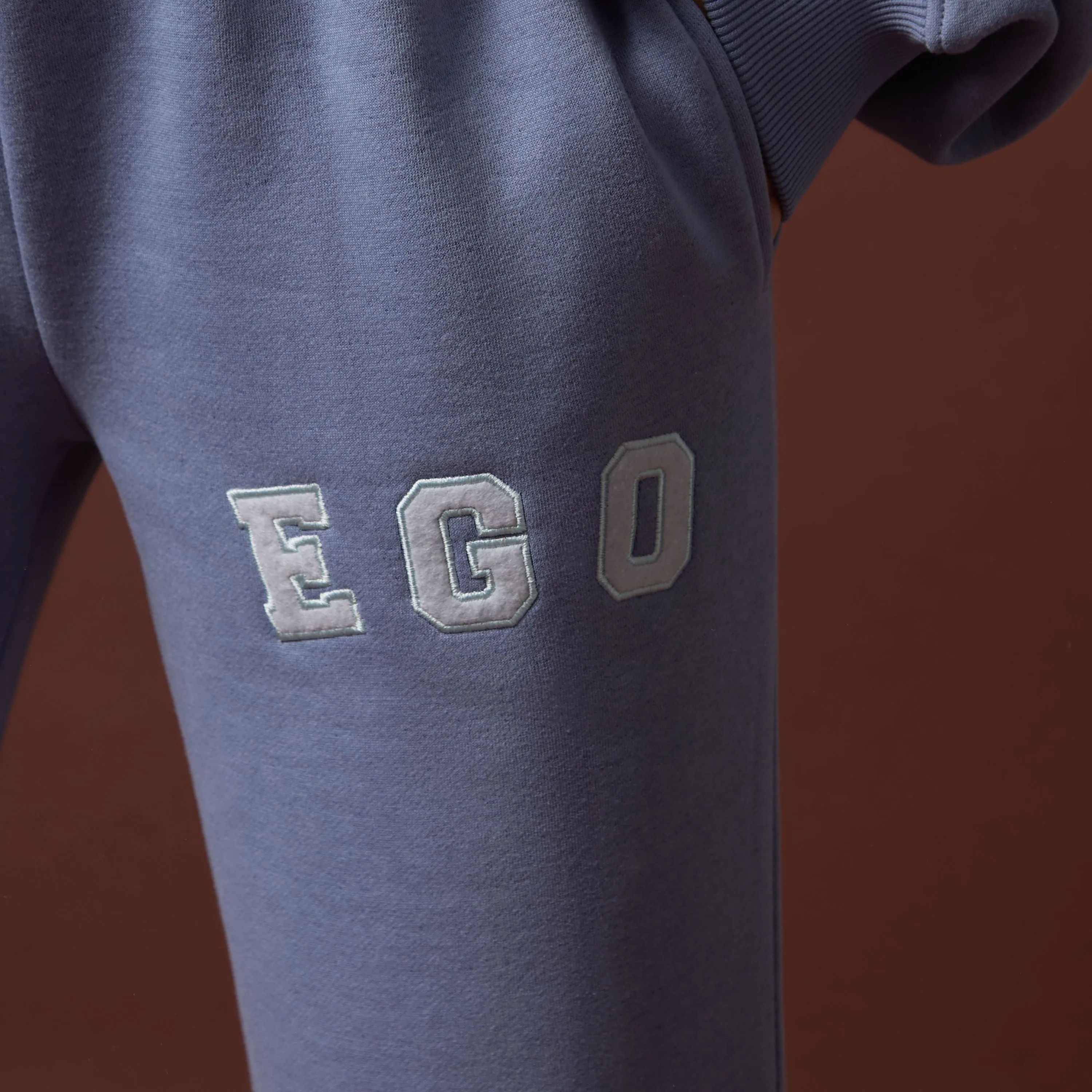 High Waist Ego Graphic Slogan Flared Leg Joggers In Dusky Blue