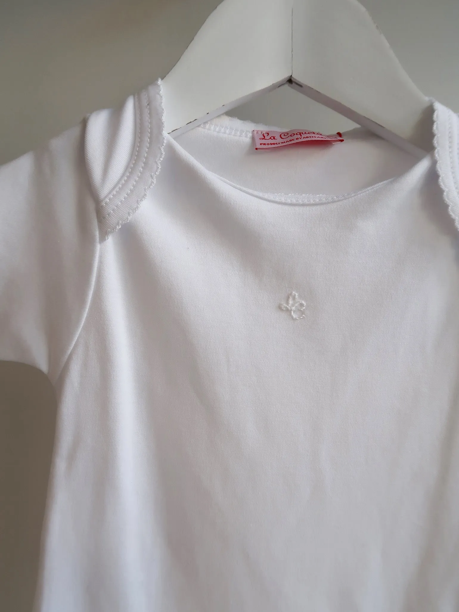 White Lupe Baby Body Vest